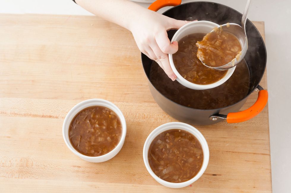 Remove the bay leaves and sprigs of thyme from your soup. Ladle into oven-safe bowls.
