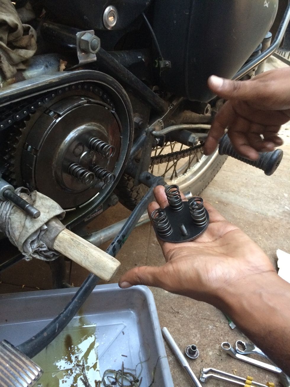 Remove the bolts and springs