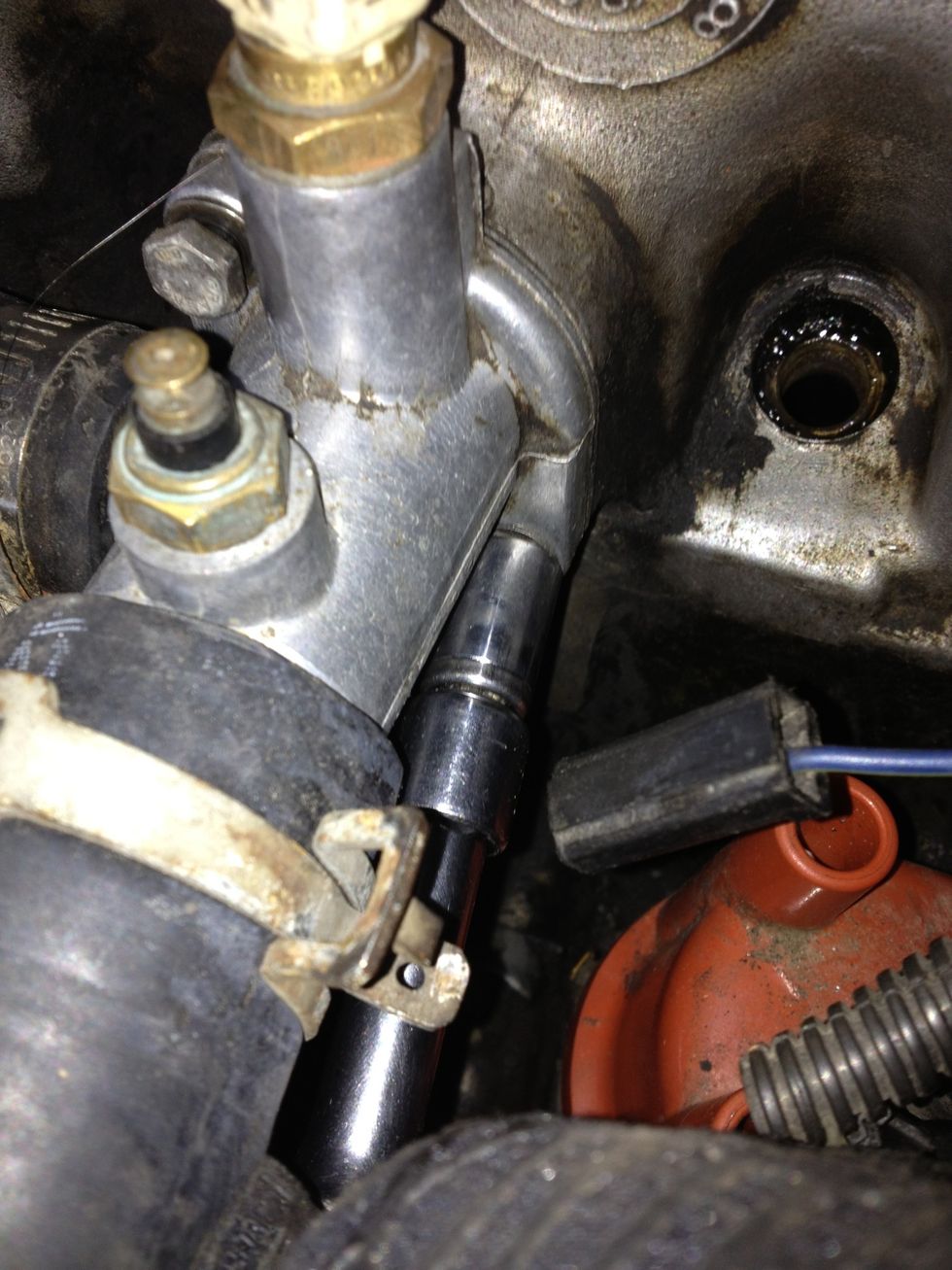 ...Remove the bottom bolt... And then finish removing the top bolt (This helps to avoid cracking the housing).