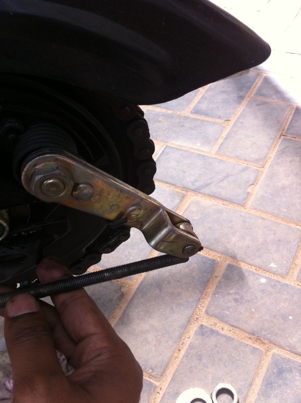 Remove the brake connecting rod out of the hook.