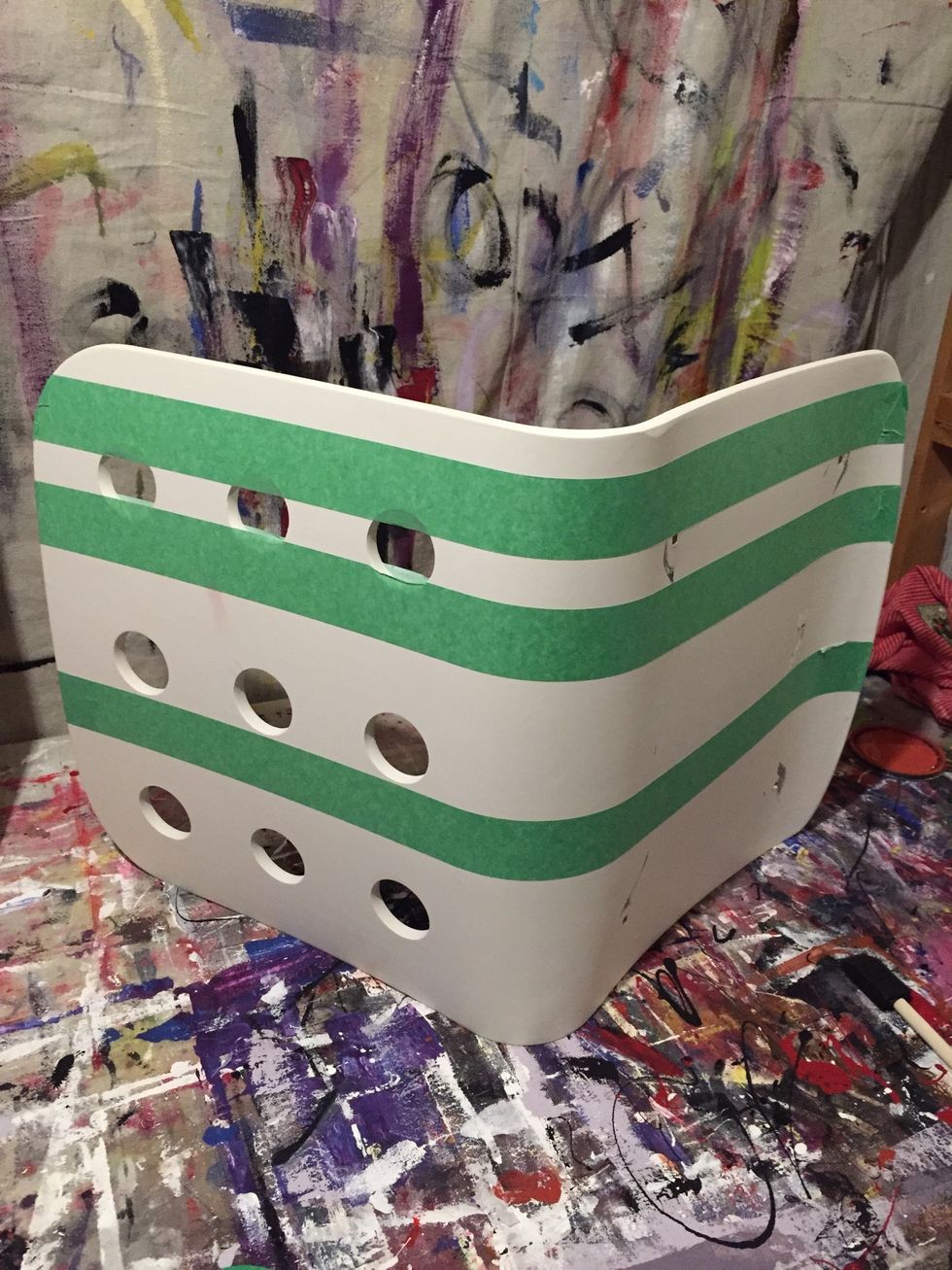 Remove the chair from the base using your wrench. Mask off the pattern you'd like to paint on the chair.