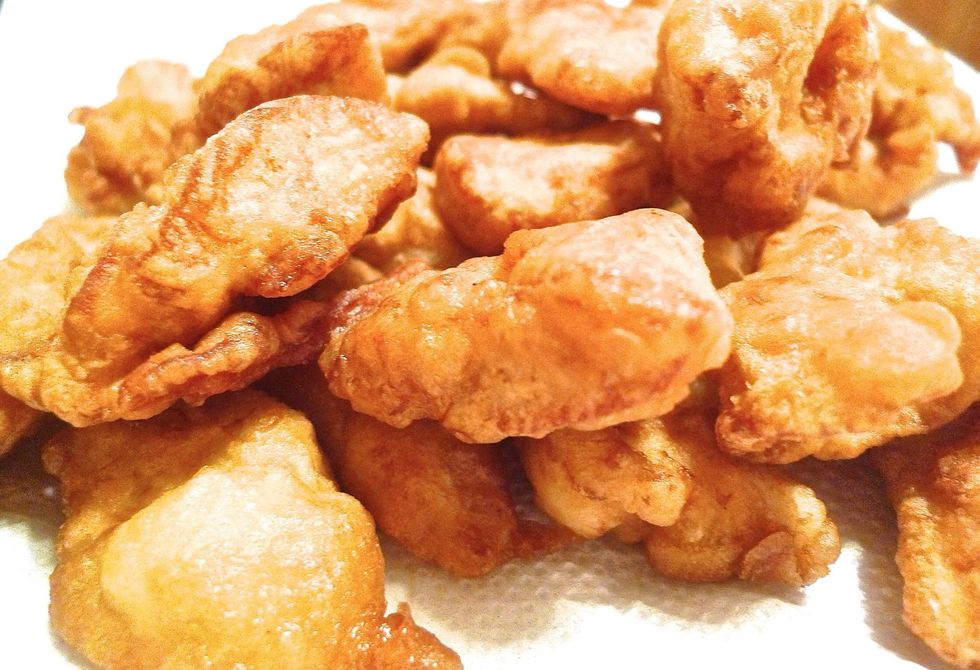 Remove the chicken and drain them on paper towels.