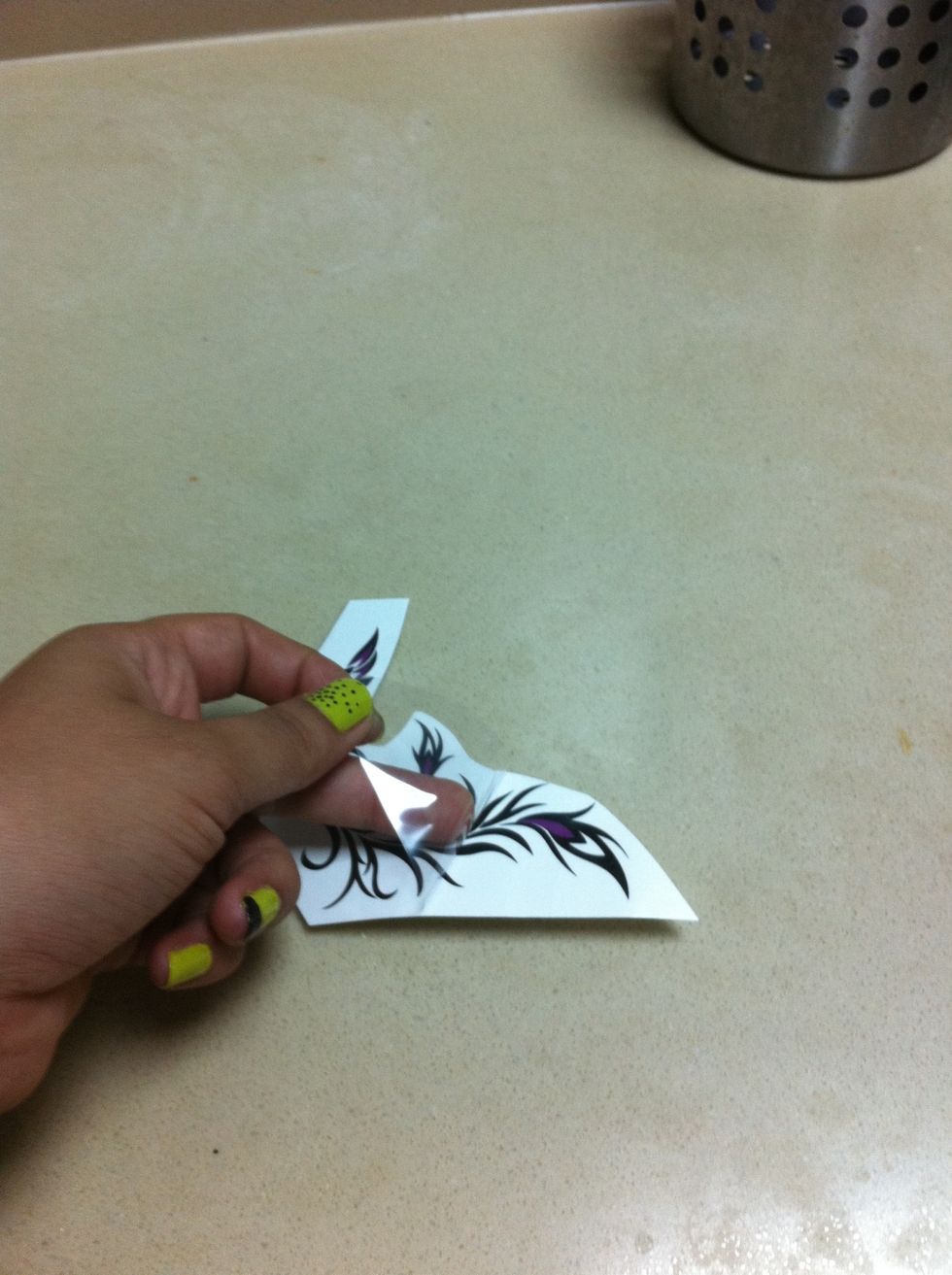 Remove the clear sheet from the tatoo