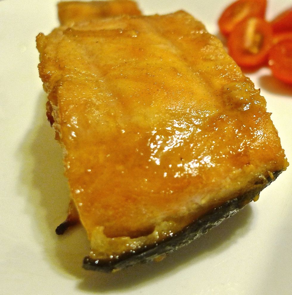 Remove the cooked salmon from the grill and serve immediately.