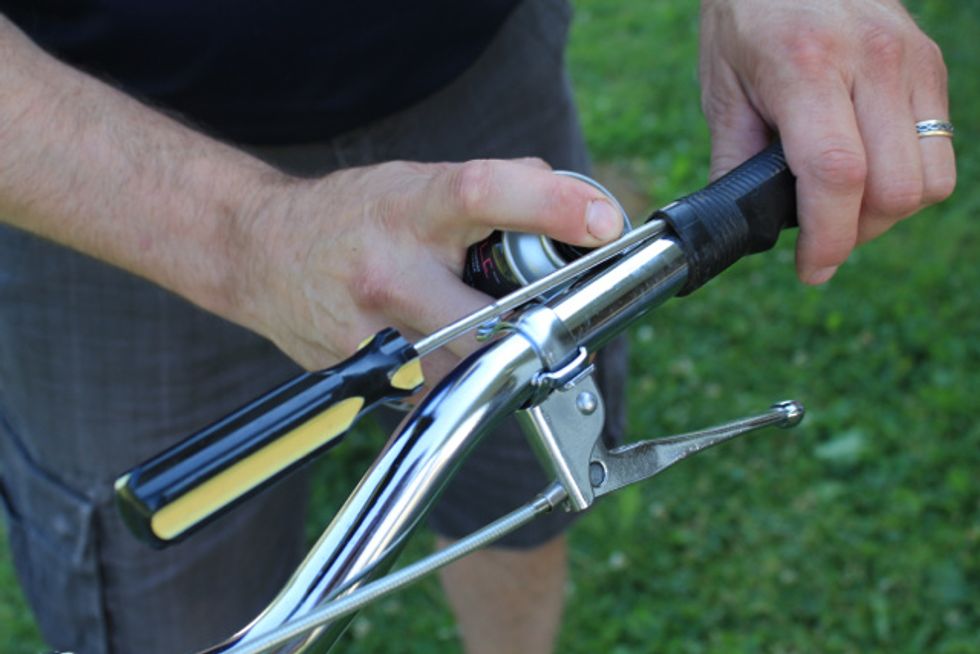 Remove the current bar grips by applying hairspray or soapy water beneath the grip. Begin twisting at the stem-end until the grip comes loose and can be removed. Repeat if necessary.