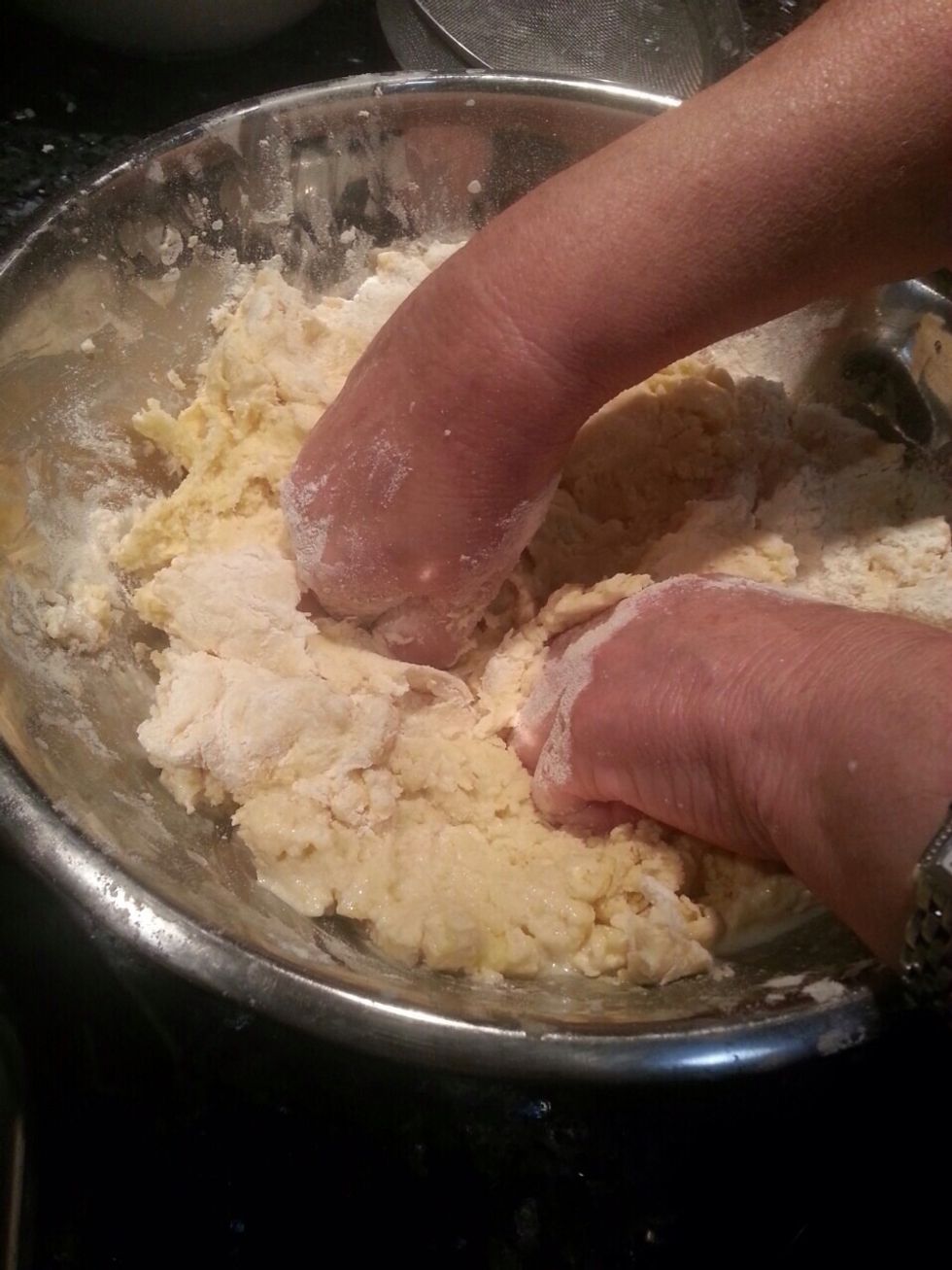 Remove the dough from the mixer and start kneading it to make a doughy pastry, add a bit of flour if needed to soften the dough