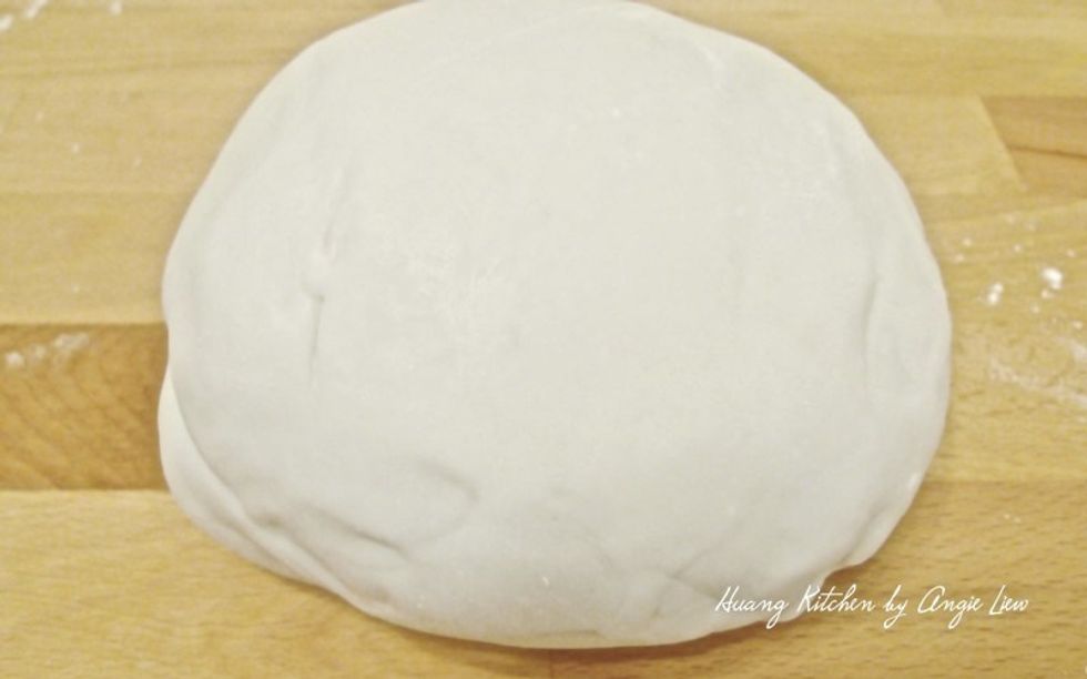 Remove the dough from the mixing bowl and when the dough is cooled slightly, knead with your hand on a floured surface until smooth.