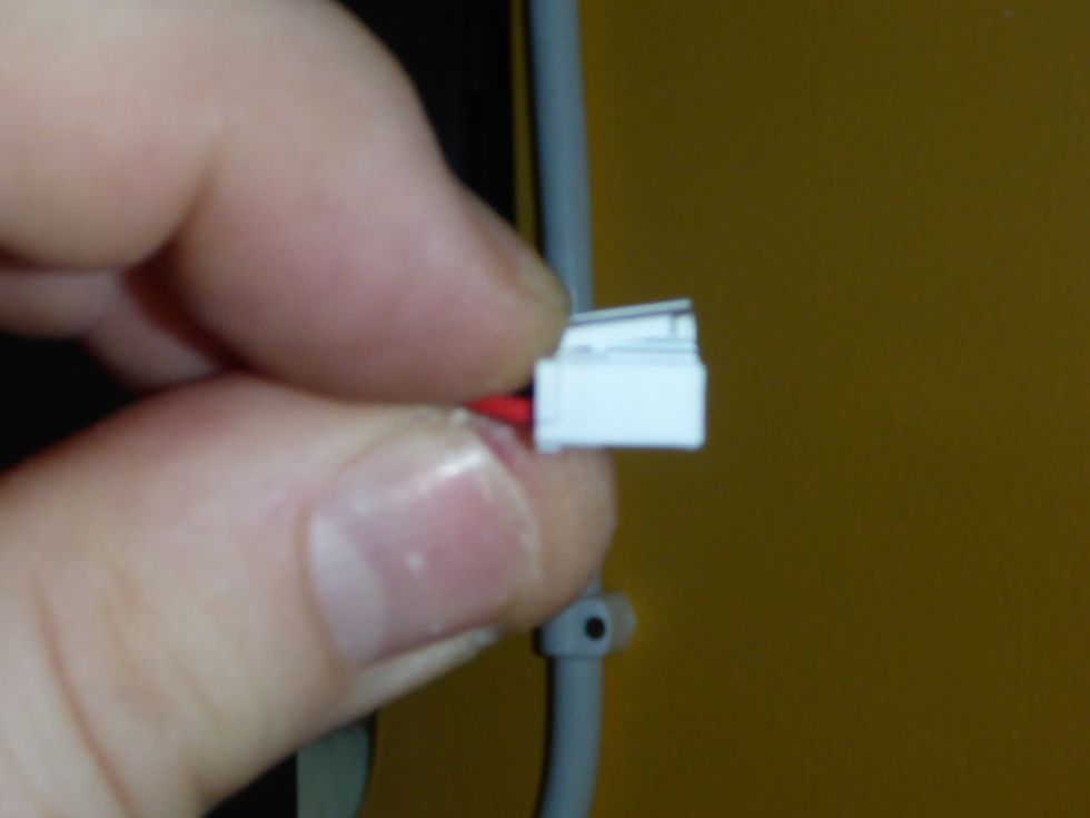 Remove the electrical connections. As you remove the cables, notice how they're routed for easy reassembly. Some connectors may have a locking tab. Release by pushing at the cable end as illustrated.