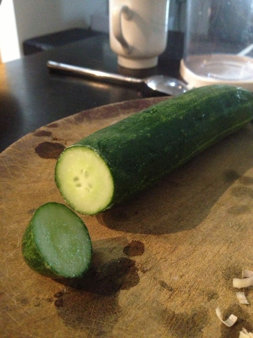 Remove the end of the cucumber and clear any gooey fluid.