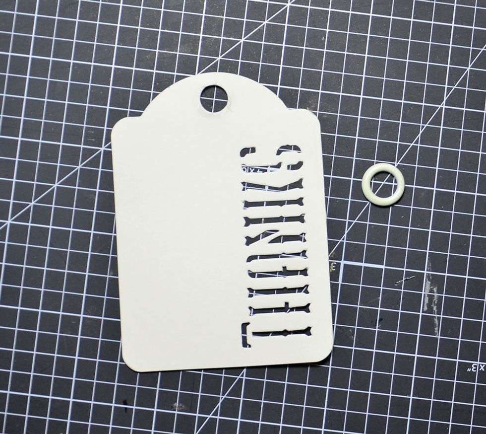 Remove the eyelet out of the top of the word tag.