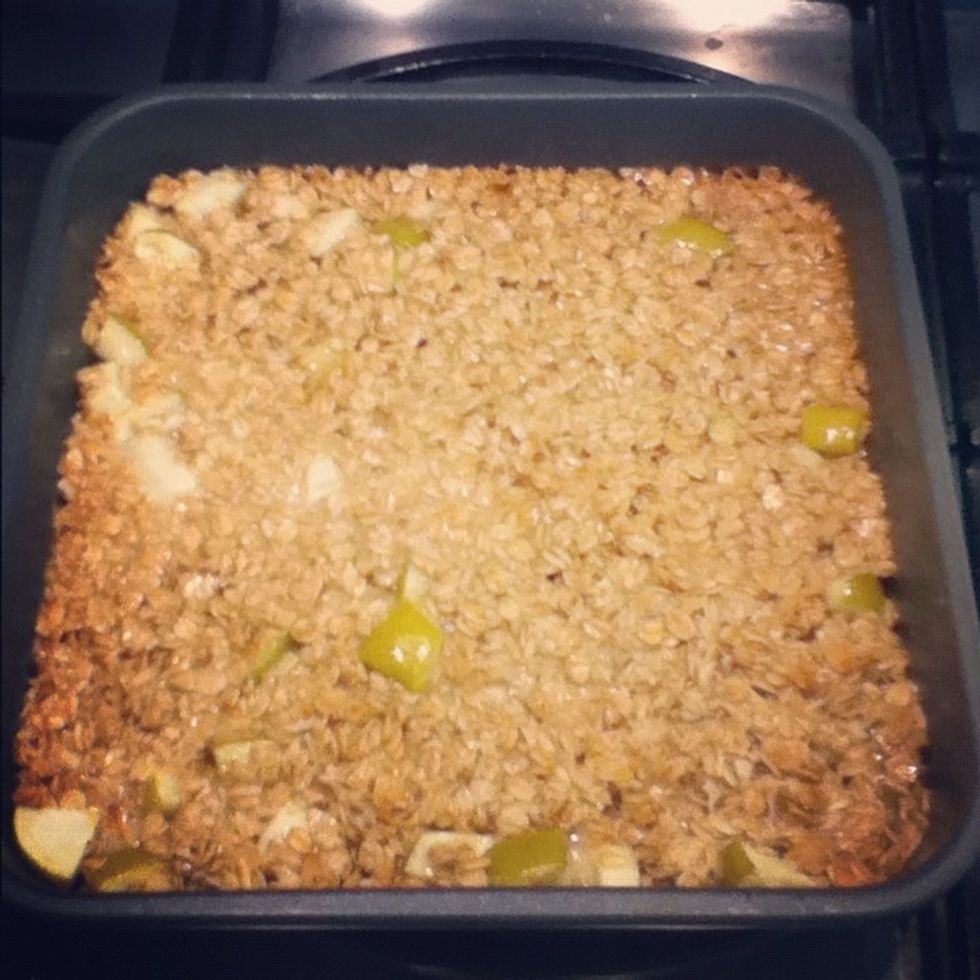 Remove the flapjack from the oven. The mixture will still be squishy- don't panic, it's supposed to be. Leave it to cool for about 20 minutes. After 20 mins check to see if it's relatively solid.