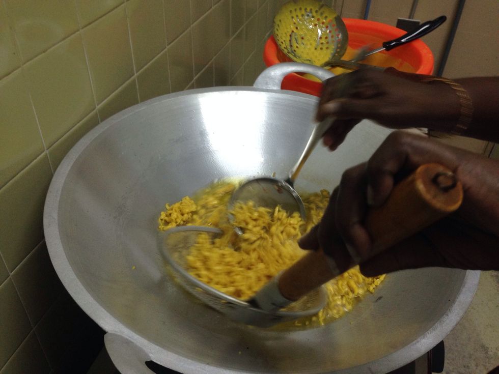 Remove the fried 'boondis' with the medium slotted spoon and keep them on paper towel to get rid of excess oil.