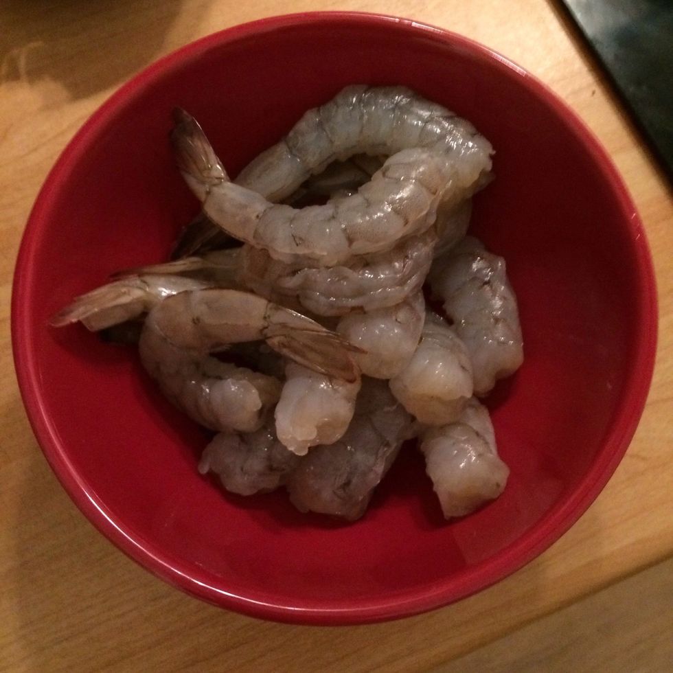 Remove the heads and peel the shrimps, leave the tails on. Rinse well