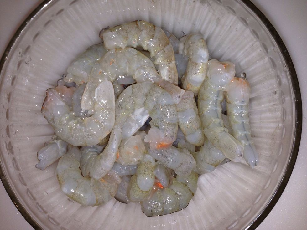 Remove the heads and shells (do not discard )