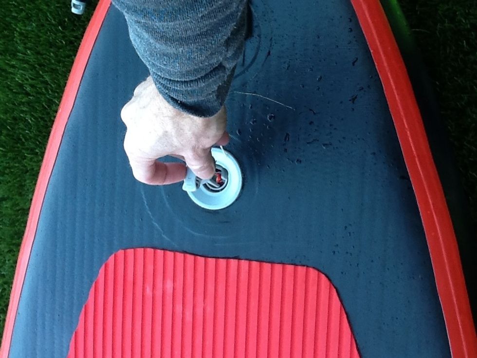 Remove the hose quickly by turning it counter clockwise. Very little air should escape if you have left the valve in the up position. Attach the protective cap by turning counter clockwise.