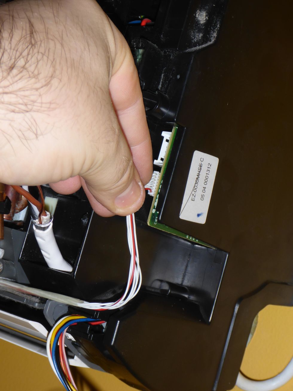 Remove the led and IR-receiver connector. Wiggle the connector loose, do not use excess force, and do not pull the cables.