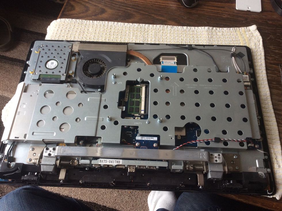 Remove the leg support bar & mechanism. 6 screws for the bar (L & R stamped on). Also 12 screws for the two mechanisms (6 each side).