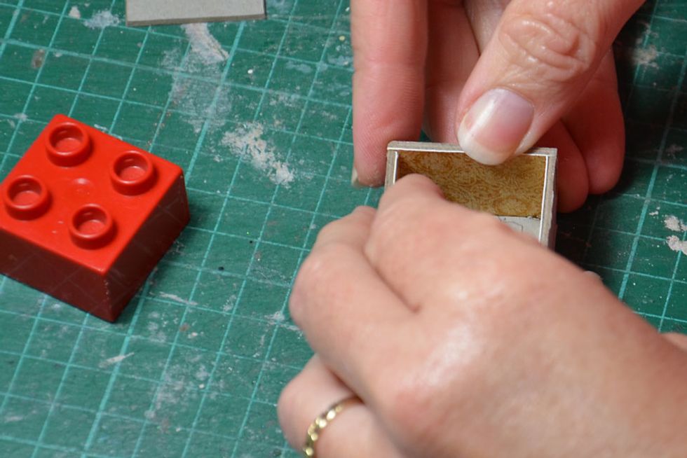 Remove the lego block before adding the final side piece.