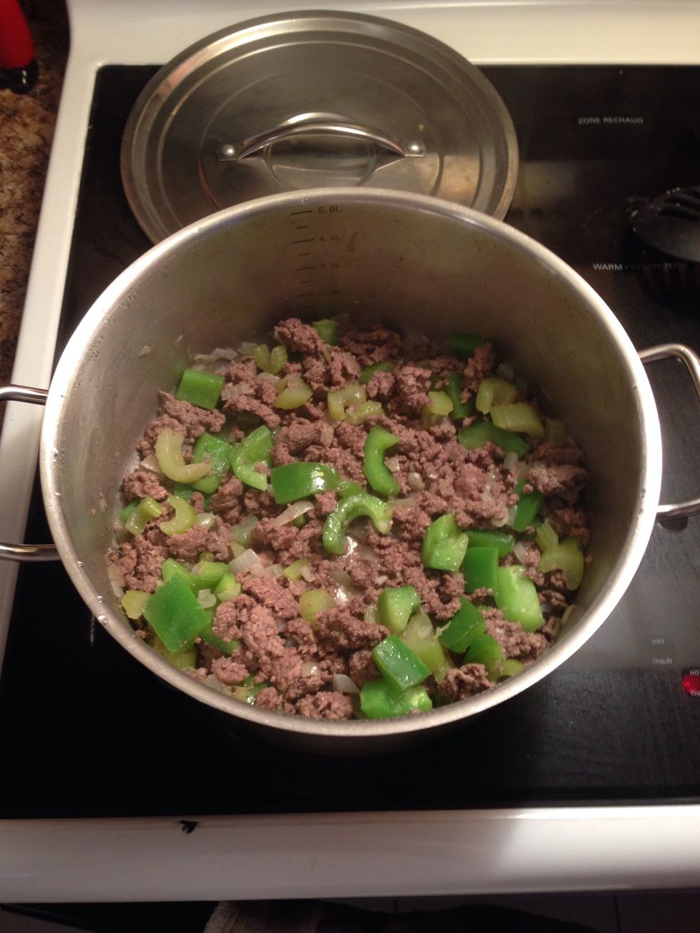 Remove the lid and make sure all the beef is cooked, then mix.