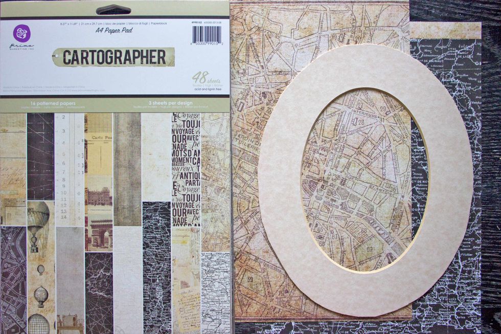 Remove the Matte from the frame, and select two contrasting papers from the Cartographer pack: