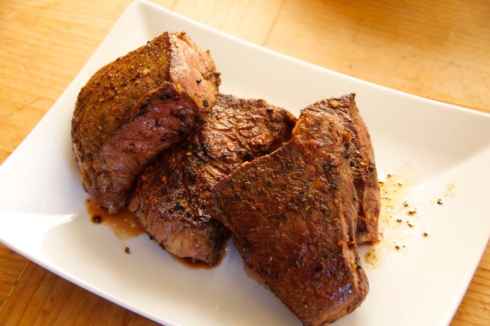 Remove the meat and place on a plate.  Make sure to save all the juice that will run off the meat so you can add it back to the pot when you add the meat again.