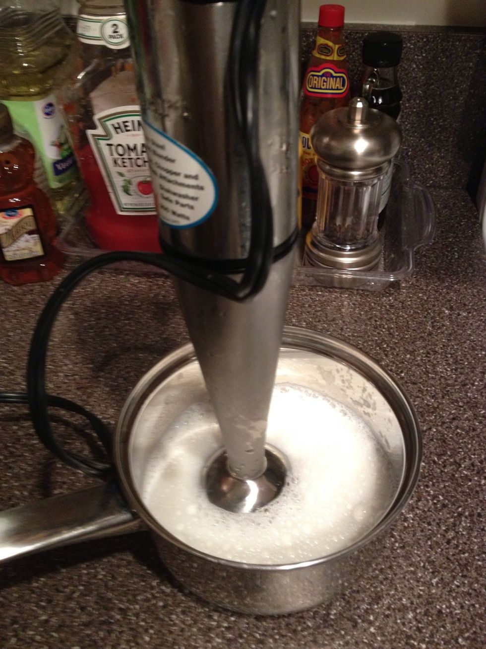 Remove the milk from the burner then whisk it with the mixer till its volume has doubled.