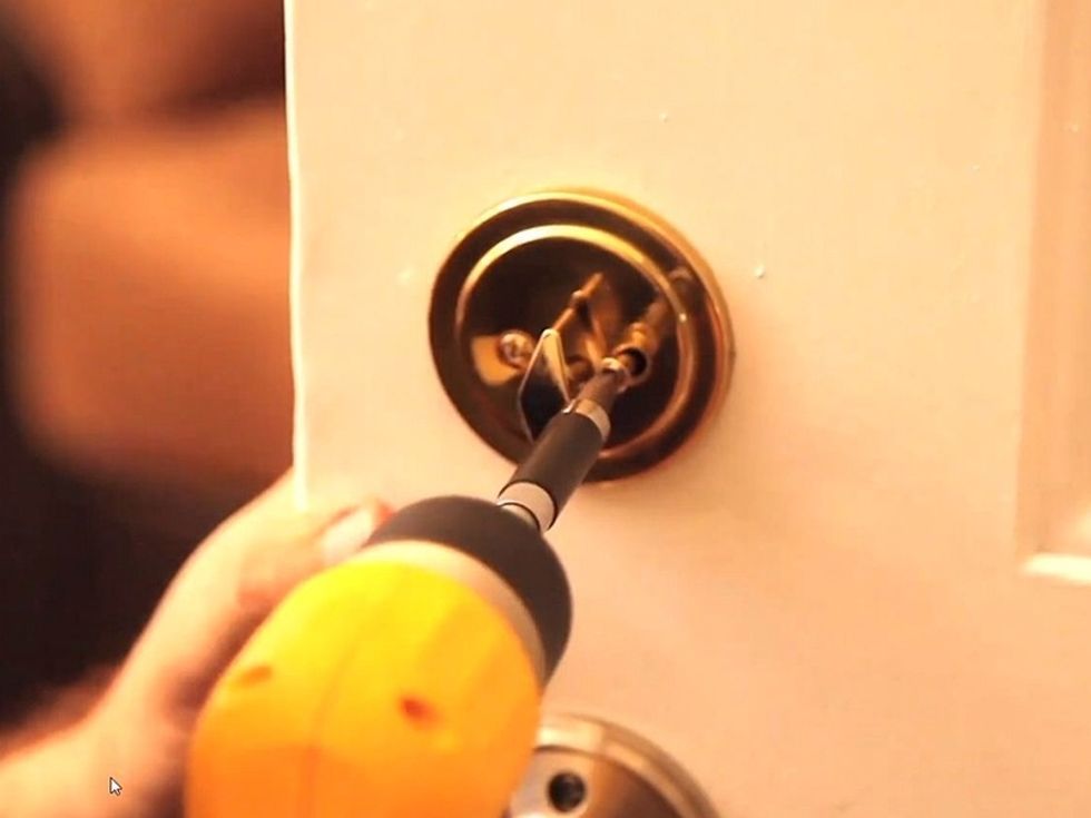 Remove the old deadbolt.