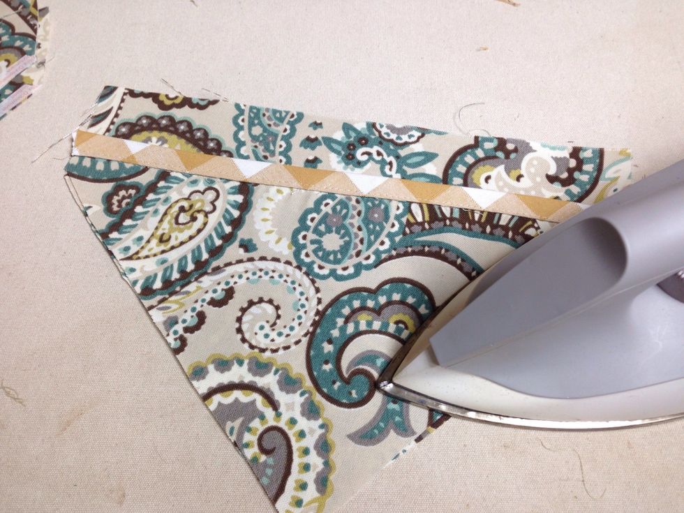 Remove the paper strip from the front side only and place large pocket on top of large point and press so that the adhesive bonds the two together. Repeat this process for all points and pockets.