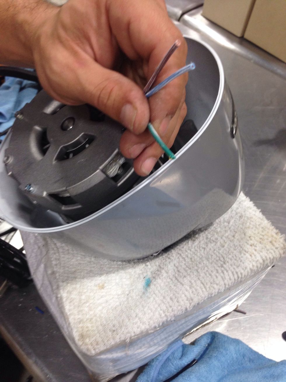 Remove the protective covering from the wires in the base of the unit