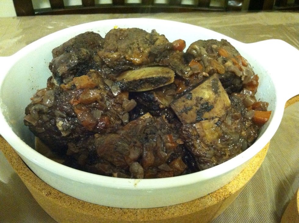 Remove the ribs from the crock pot, strain the cooking liquid into a sauce pan,  and cook until it has reduced to about one cup. Whisk in the tomato paste and pour over your short ribs before serving.