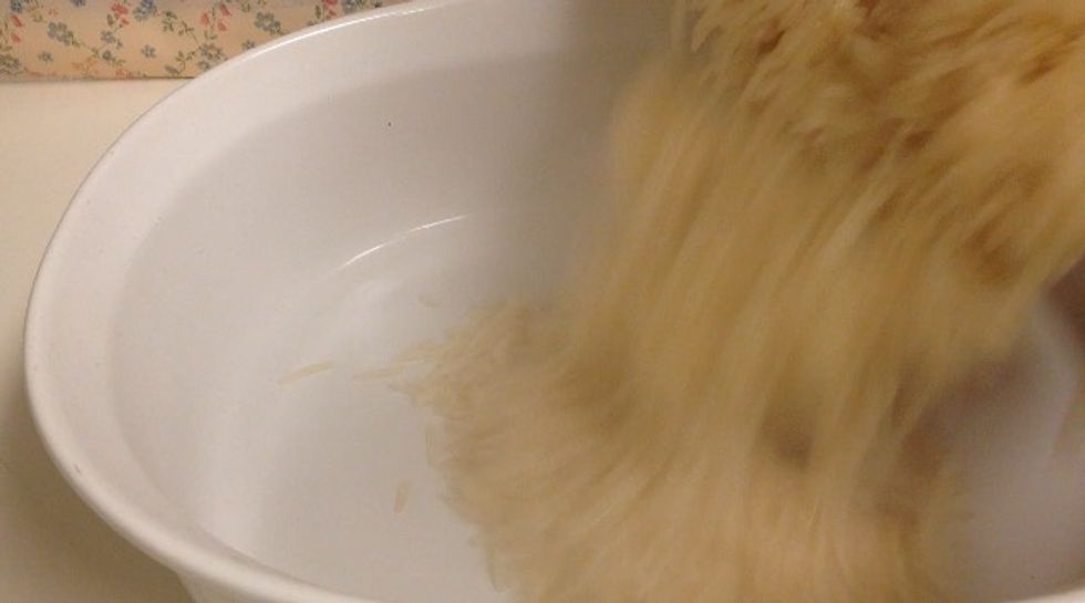 Remove the rice into the baking tray ..