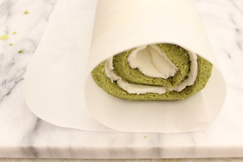 Remove the ruler while holding down the paper and roll.