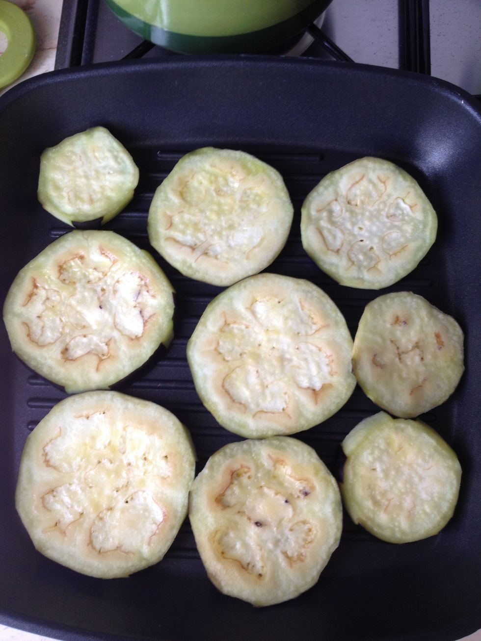 Remove the salt and dry (use paper towels) the slices, rinse them with olive oil and start grilling them