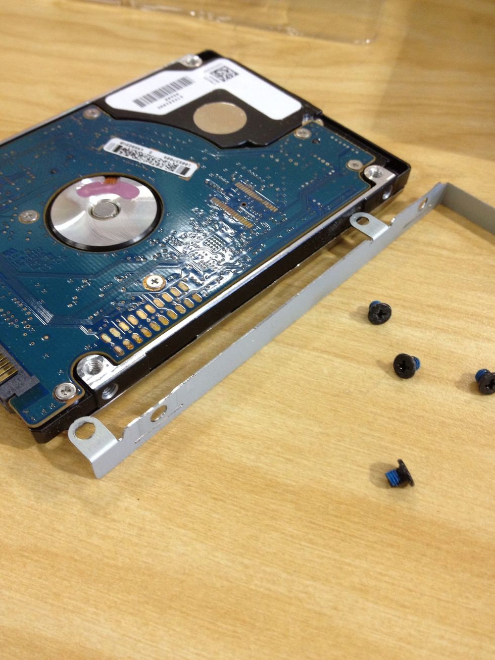 Remove the screws and take off the bracket.