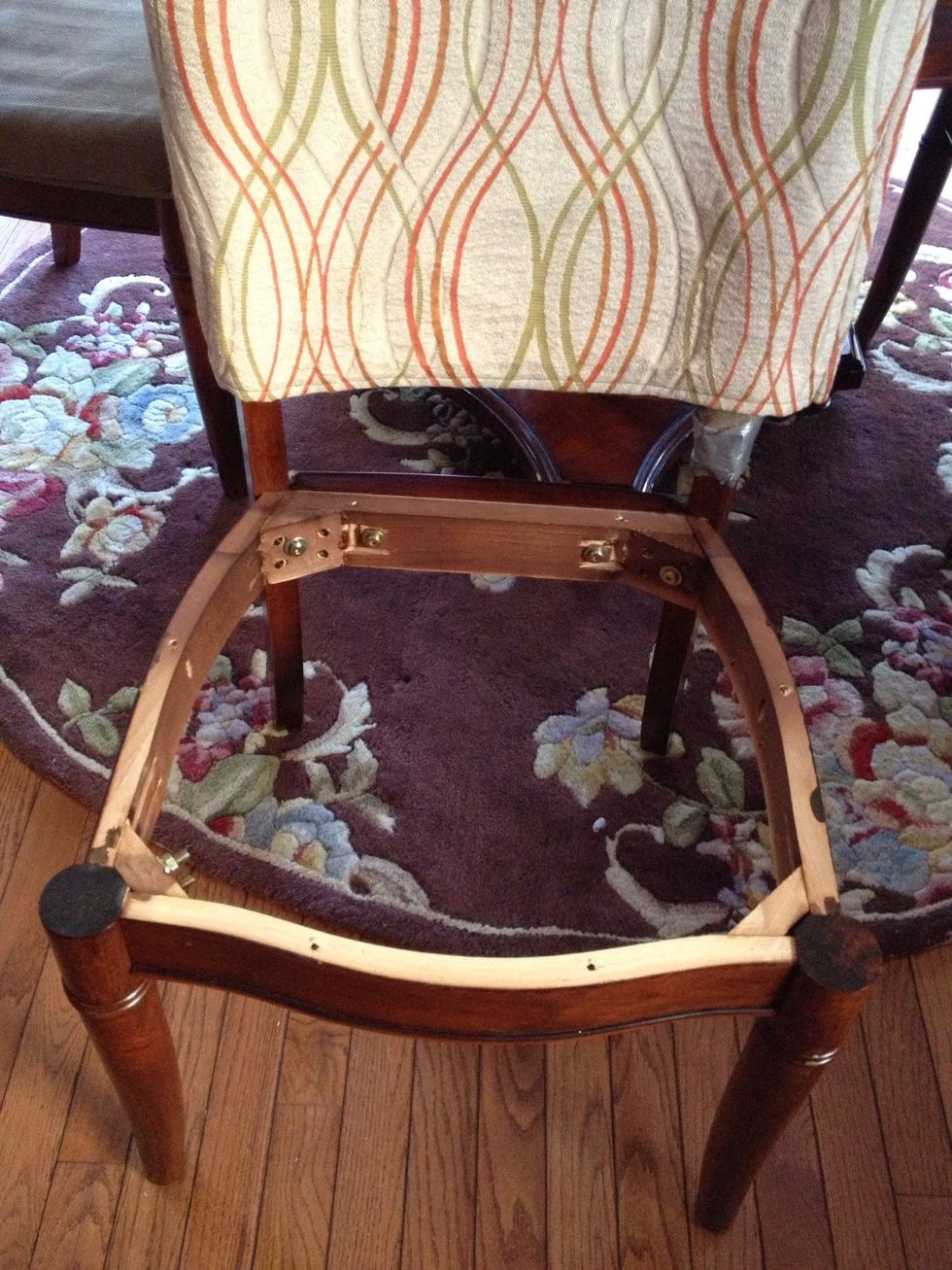 Remove the screws underneath to take the cushion off the chair.