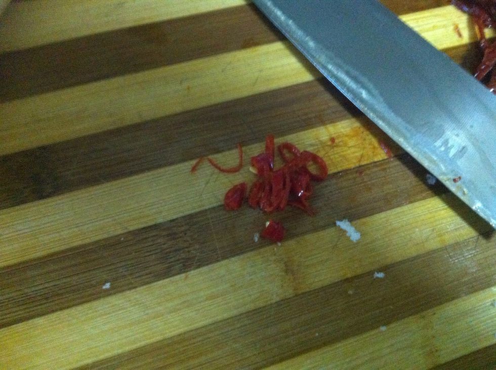Remove the seeds from the chile, and thinly slice it. Keep the seeds if you like it hot