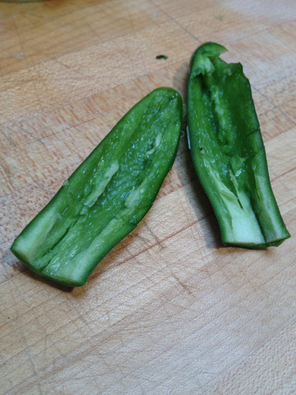Remove the seeds from the Serrano chile.