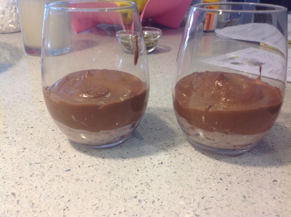 Remove the serving glasses from the refrigerator and pour the dark chocolate mixture on top of the ricotta layer.