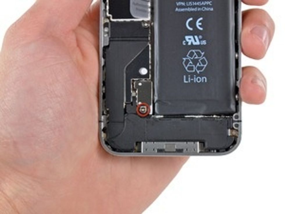 Remove the single 2.5 mm Phillips screw securing the battery connector to the logic board. Some devices may have two screws, one of which holds down the contact pad.