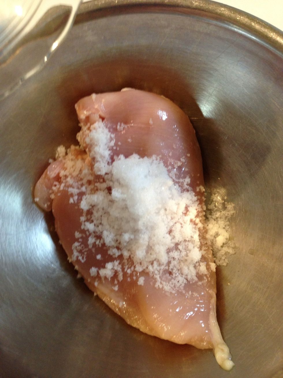Remove the skin of chicken breast, rub the salt on it.
