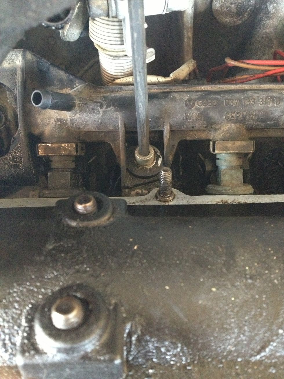 Remove the socket head mounting bolt securing the fuel rail to the intake manifold.... Left here... - 5mm hex wrench