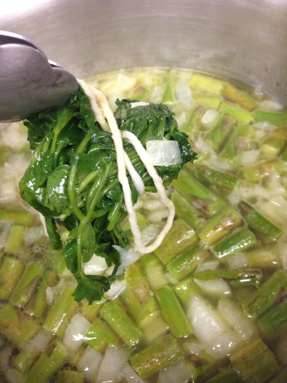 Remove the soup from the oven and take out the parsley.