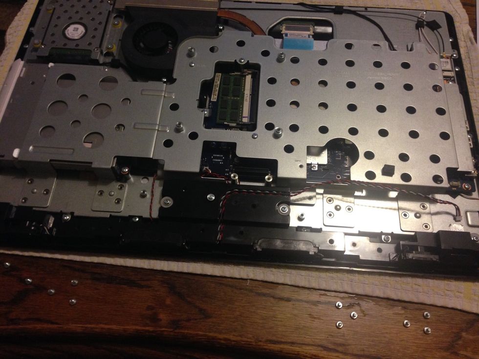 Remove the speaker assembly (4 screws) and disconnect the cable.