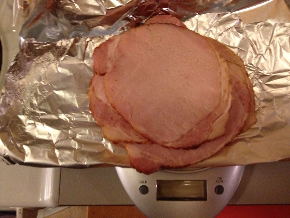 Remove the string, then slice it. Usually a piece weighs about 1,5 kilos. Depending on how many you are feeding, freeze the rest, or fry the leftovers and have it with eggs for breakfast.