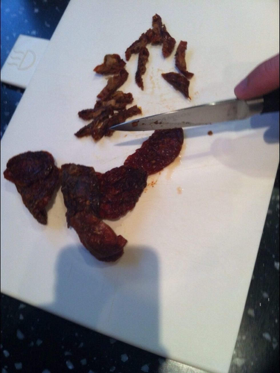 Remove the tomatoes from the water and pat dry with kitchen paper. Chop into small pieces