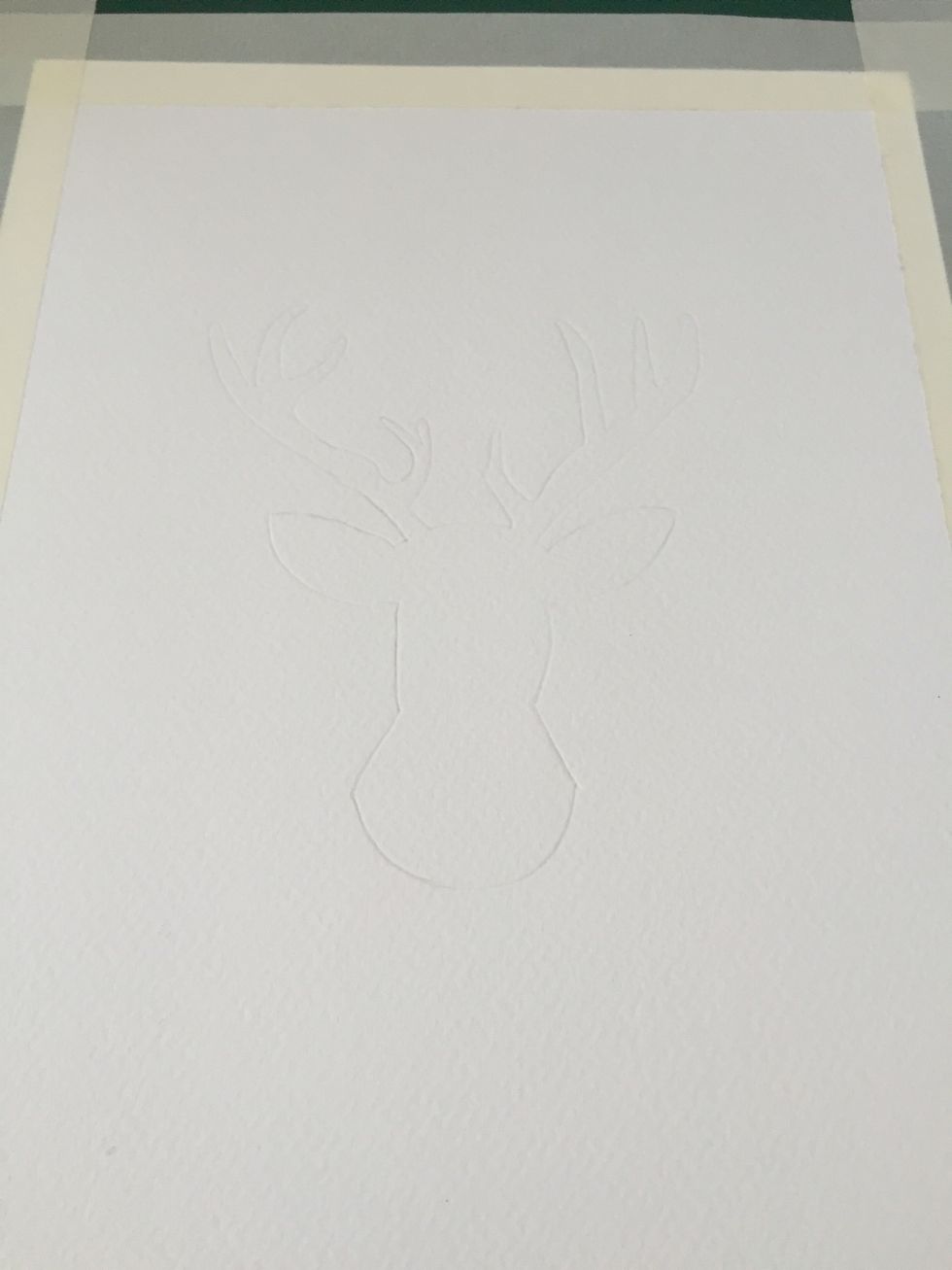 Remove the transparent paper. Done properly you will see the outlines of the deer pressed into your watercolor paper.