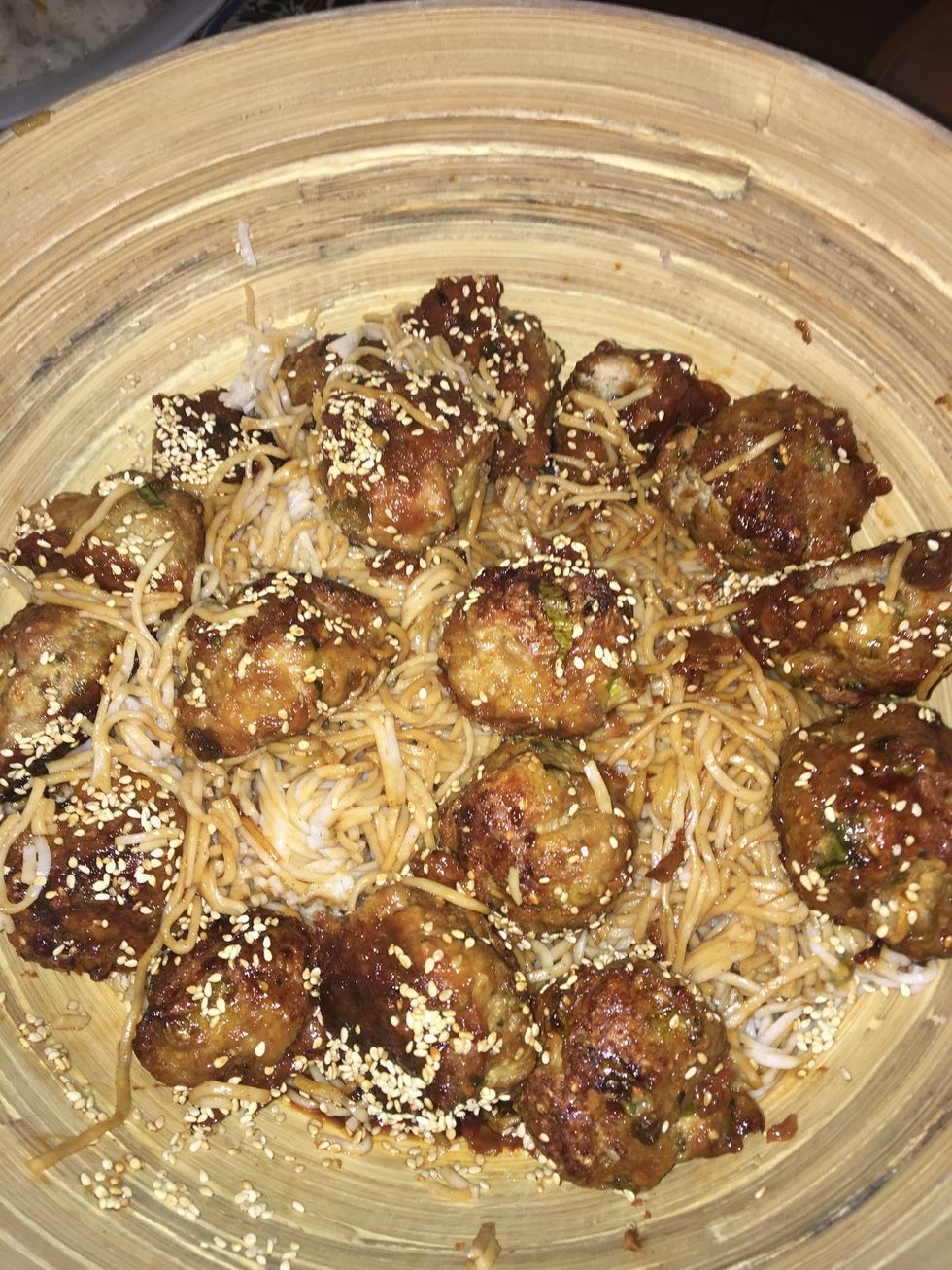 Remove the tray from the oven, add the dashi mixture and carefully toss to coat the meatballs. Cook for 15 minutes or until meatballs are golden. Serve the meatballs with the noodles