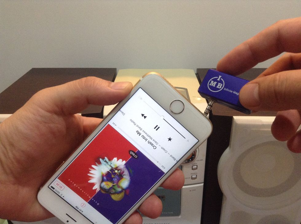 Remove the USB charger of the transmitter and plug it into the iPhone 6 audio output