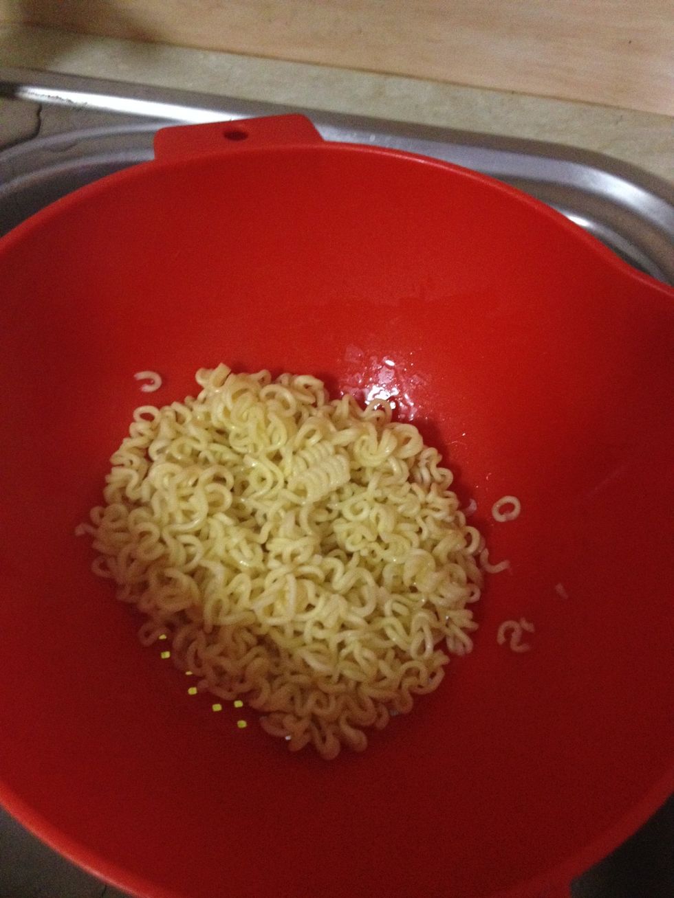Remove the water and allow the noodles to cook off heat. That's the secret ;)