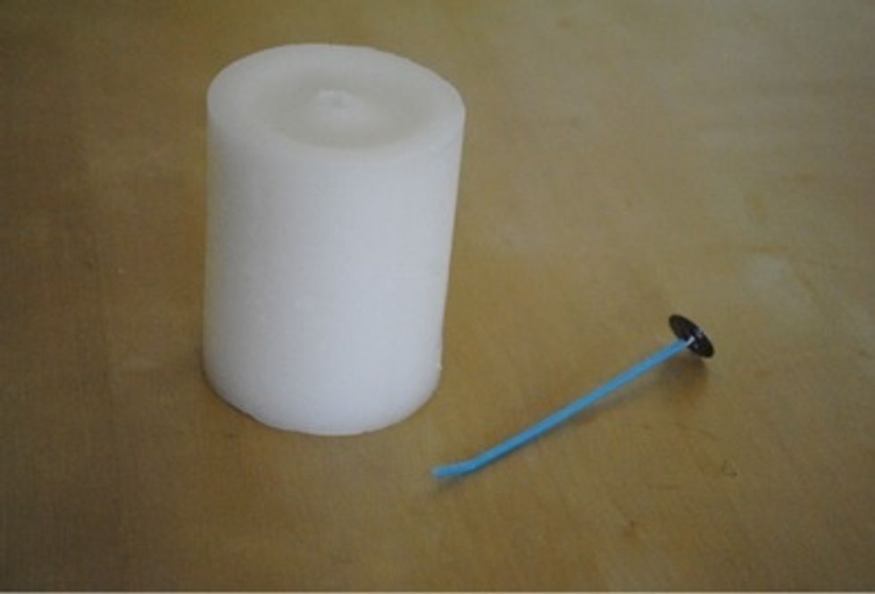 Remove the wick from the candle. On most candles it is easily removed by pulling it from the bottom. It is recommended that you check this when you buy it.